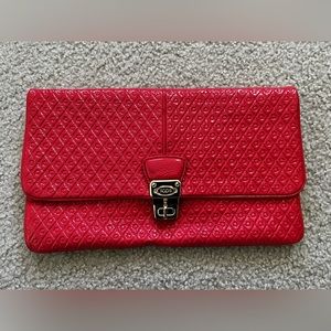 Tod’s coral orange signature embossed patent leather clutch